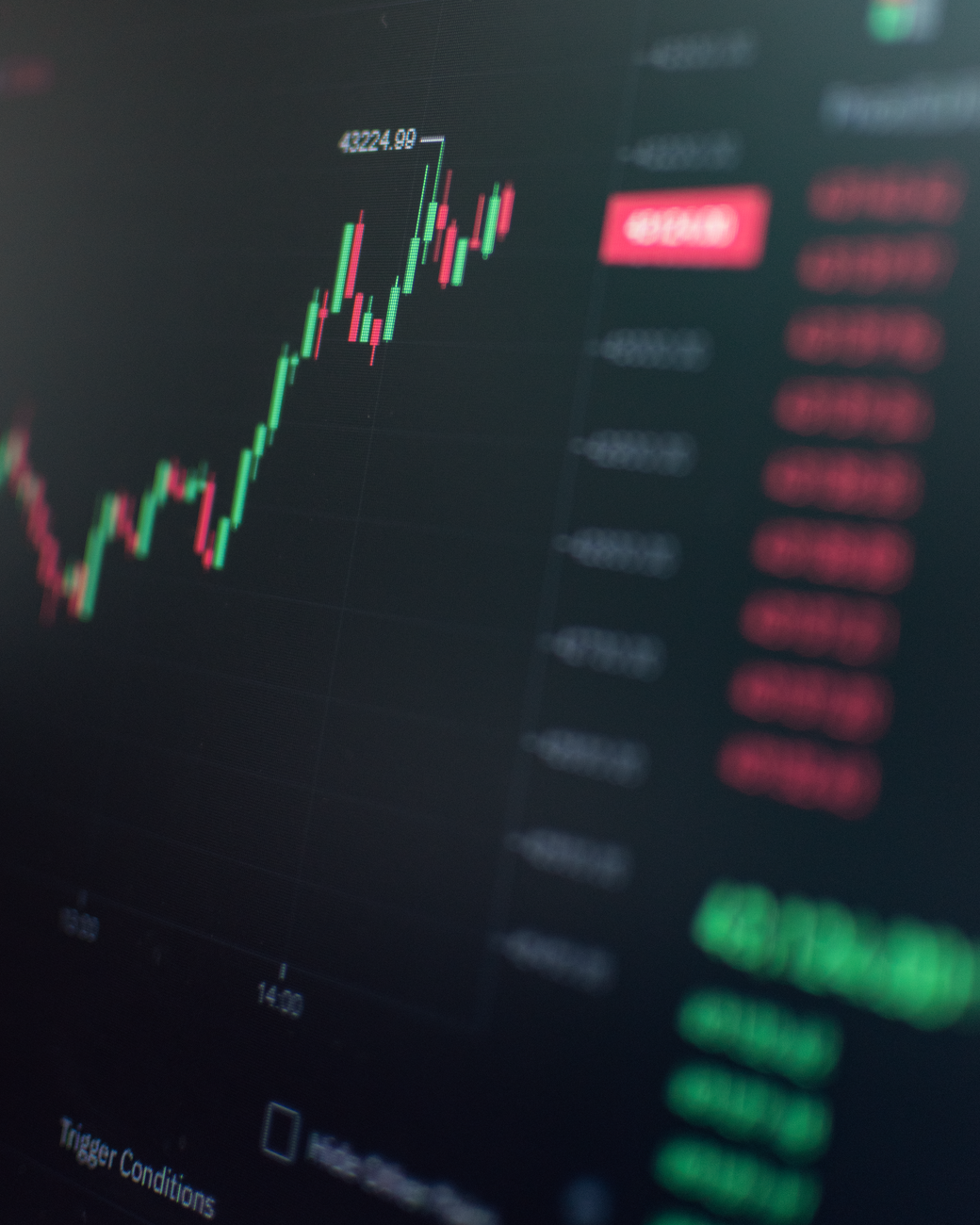 Traders monitor stock prices on market screens as U.S. stocks trade near record highs after reopening from the Juneteenth holiday.
