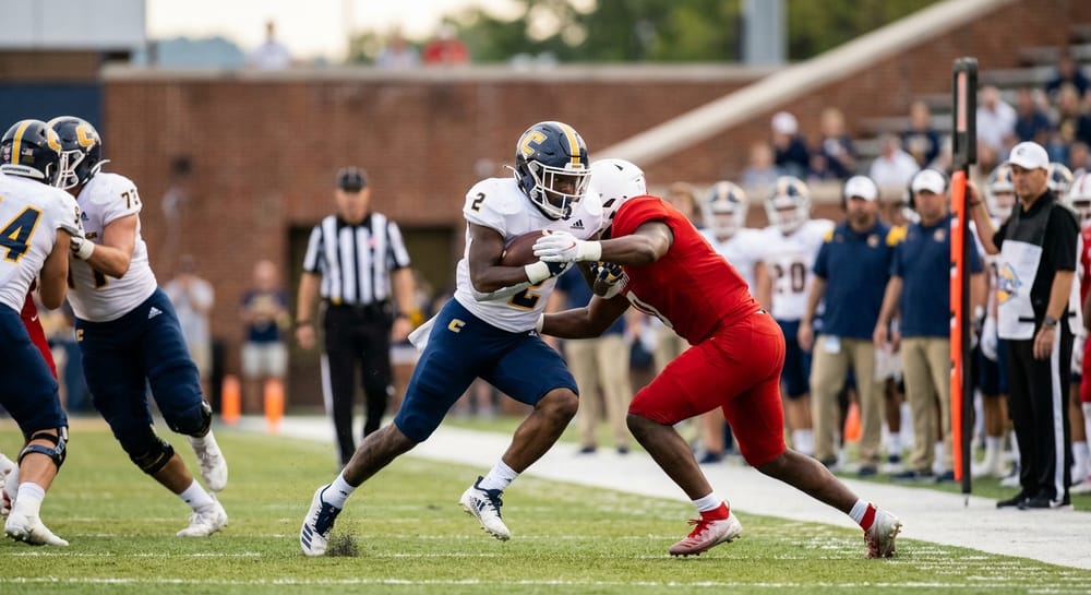 UTC Mocs football action in Chattanooga, with players on the field during a game tied to discussion of future buy games against FBS opponents.