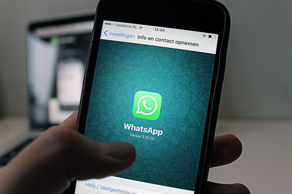 Person using WhatsApp on a smartphone in Chattanooga, showing chat privacy and account settings context