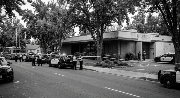 Police vehicles outside the Chico library in Chico, California, after the fatal shooting investigation