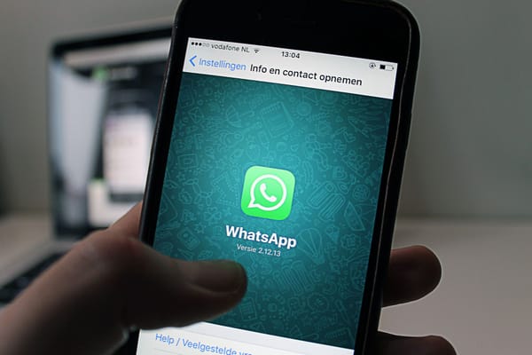Person using WhatsApp on a smartphone in Chattanooga, showing chat privacy and account settings context